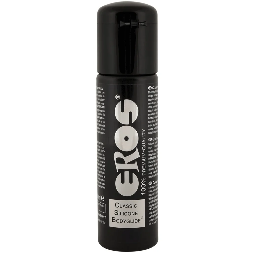 Sort flaske Eros Classic Silicone Bodyglide 100 ml med sølvfarvet EROS-logo og klapprop, fotograferet forfra mod en hvid baggrund
