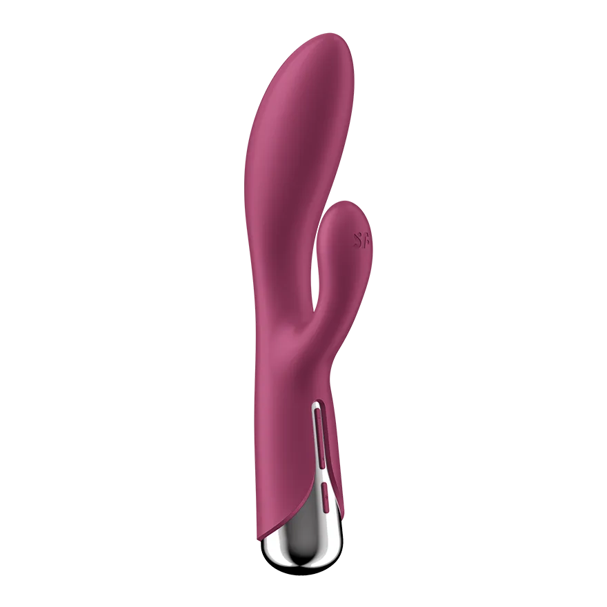 Satisfyer Spinning Rabbit 1 i rött, sedd snett från sidan med klitorisarmen och det roterande skaftet